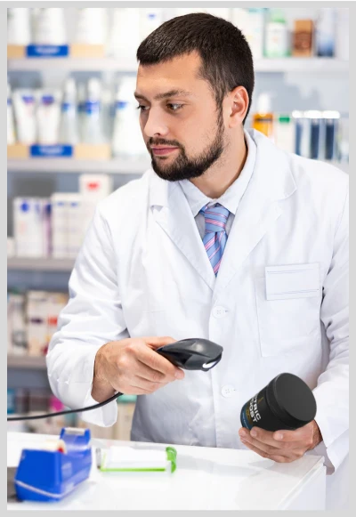 chemist scanning nitric boost at the cash counter